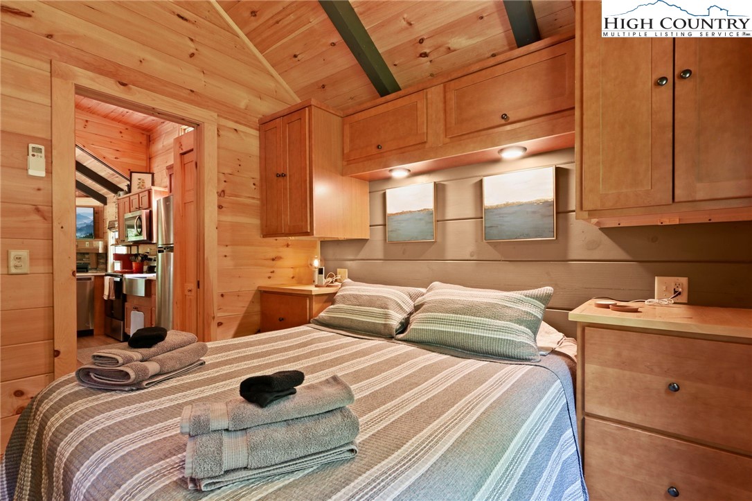 165 John Dotson Road Boone, NC 28607 - Photo 34 of 50 a bedroom with a bed and a mirror