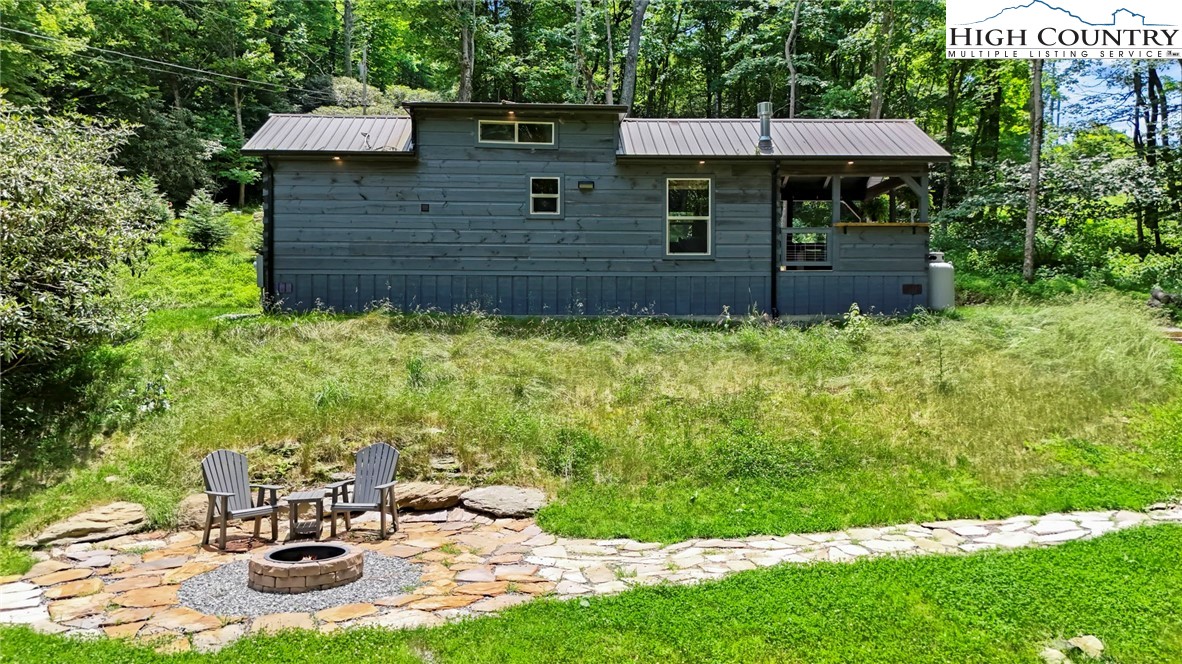 165 John Dotson Road Boone, NC 28607 - Photo 4 of 50 a backyard of a house with table and chairs