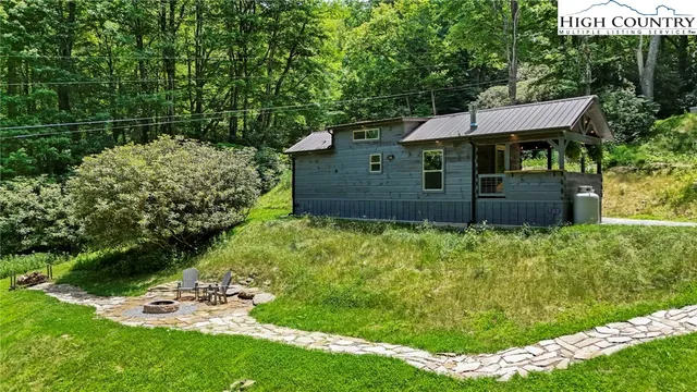 a view of a chair and table on the garden