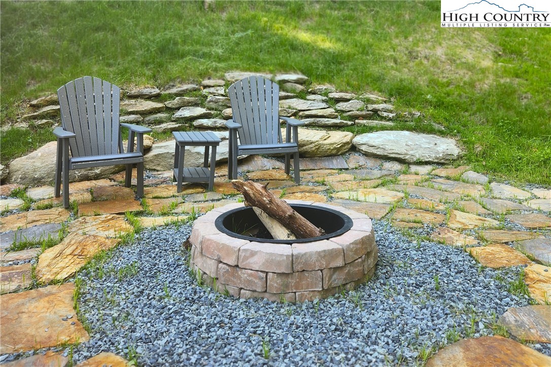 165 John Dotson Road Boone, NC 28607 - Photo 46 of 50 a view of a swimming pool with chairs