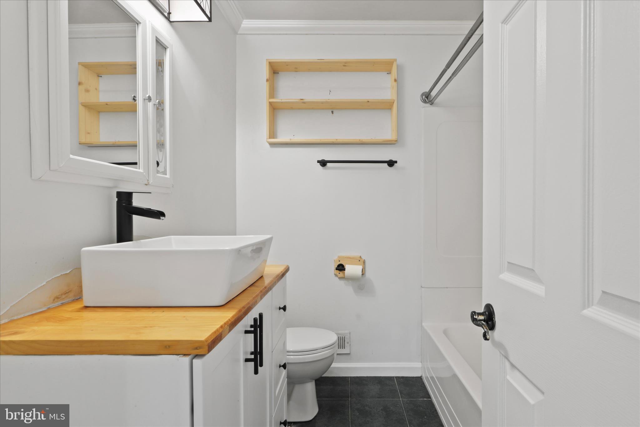 112 Main Avenue Southeast Glen Burnie, MD 21061 - Photo 19 of 45 a bathroom with a granite countertop sink mirror vanity and toilet
