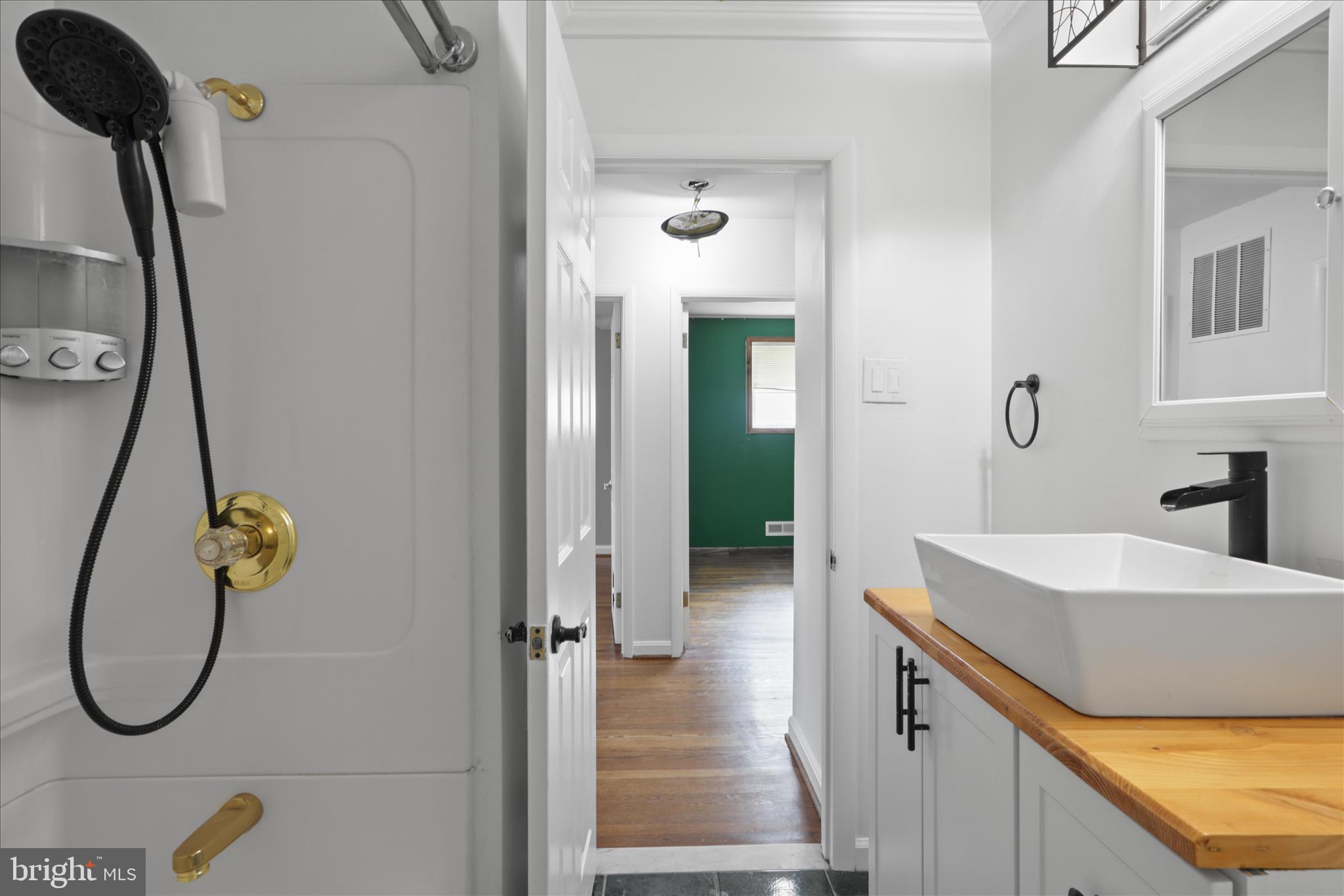 112 Main Avenue Southeast Glen Burnie, MD 21061 - Photo 20 of 45 a bathroom with a sink and a mirror