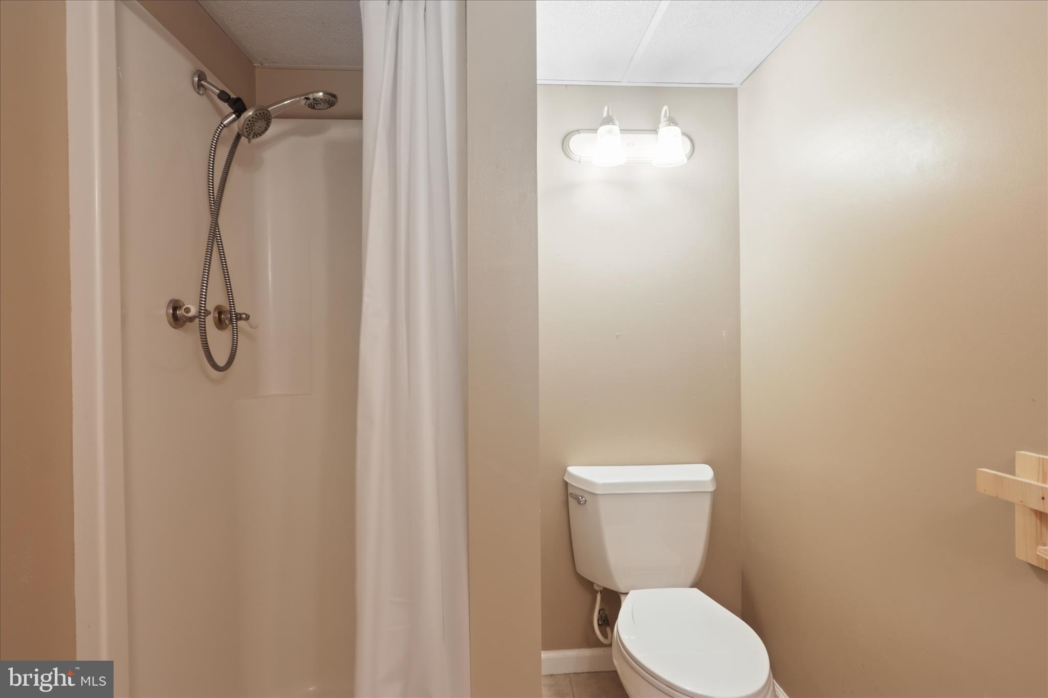 112 Main Avenue Southeast Glen Burnie, MD 21061 - Photo 28 of 45 a white toilet sitting next to a bathroom sink