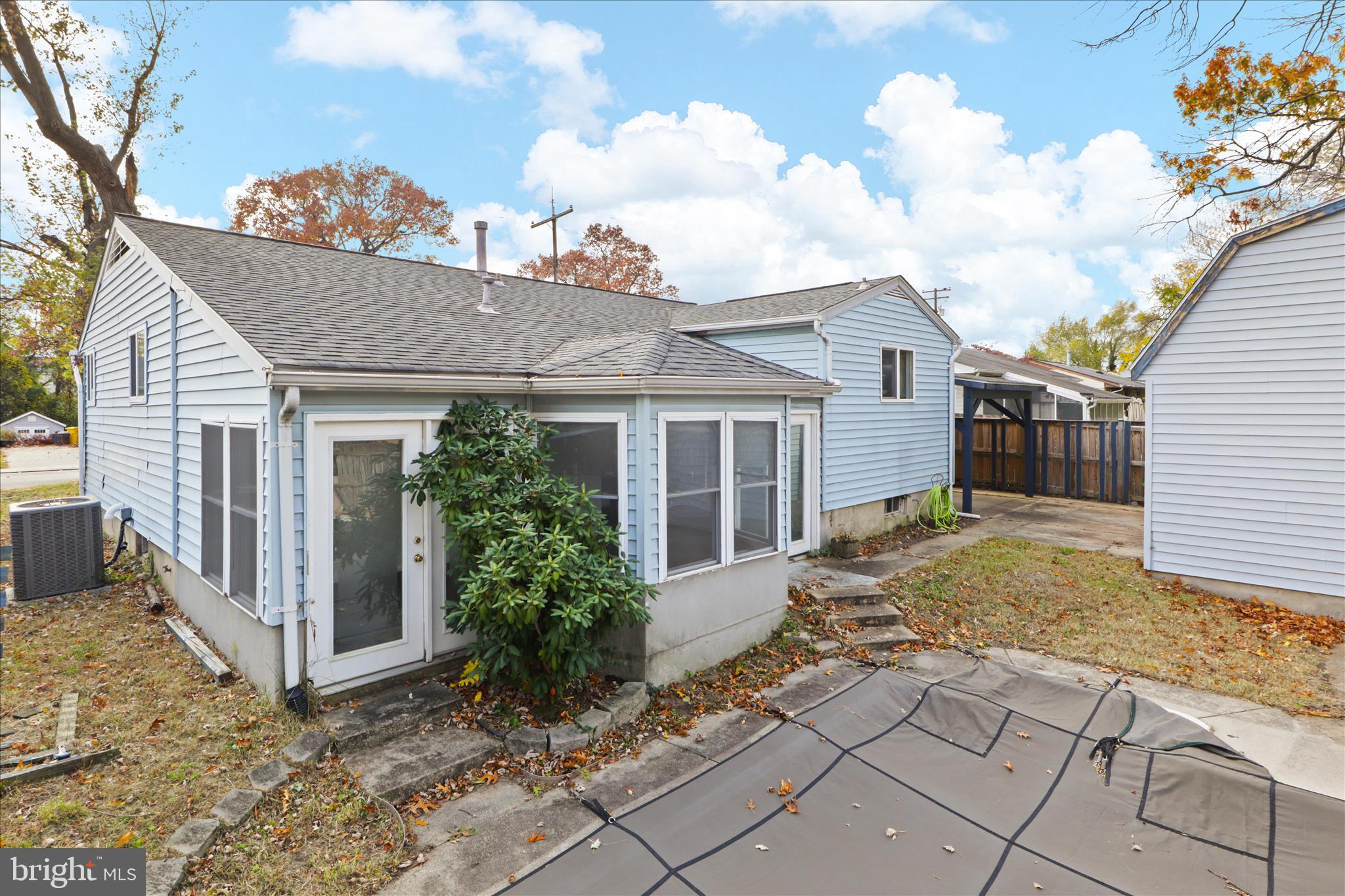 112 Main Avenue Southeast Glen Burnie, MD 21061 - Photo 31 of 45 a view of a house with a small yard and wooden floor and fence and a tree