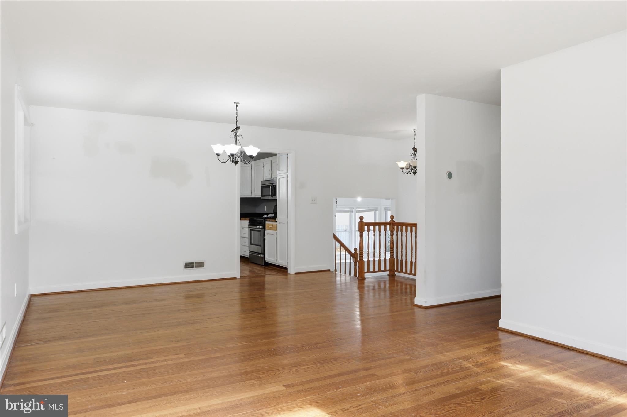 112 Main Avenue Southeast Glen Burnie, MD 21061 - Photo 5 of 45 a view of empty room with wooden floor