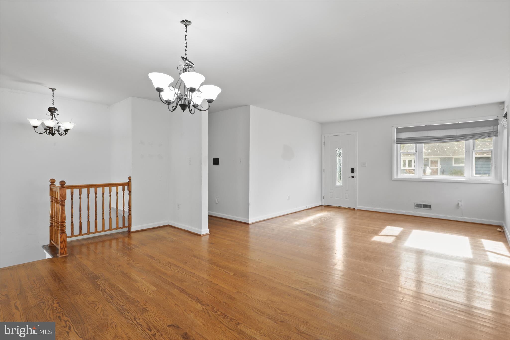 112 Main Avenue Southeast Glen Burnie, MD 21061 - Photo 7 of 45 a view of a room with wooden floor chandelier and a window