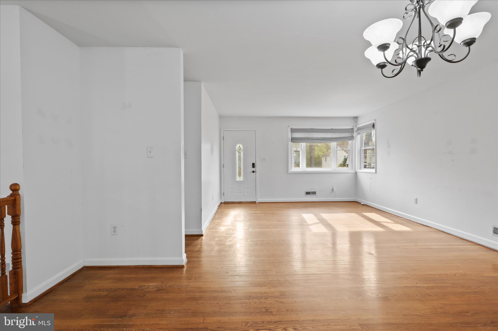 112 Main Avenue Southeast Glen Burnie, MD 21061 - Photo 9 of 45 a view of an empty room with wooden floor