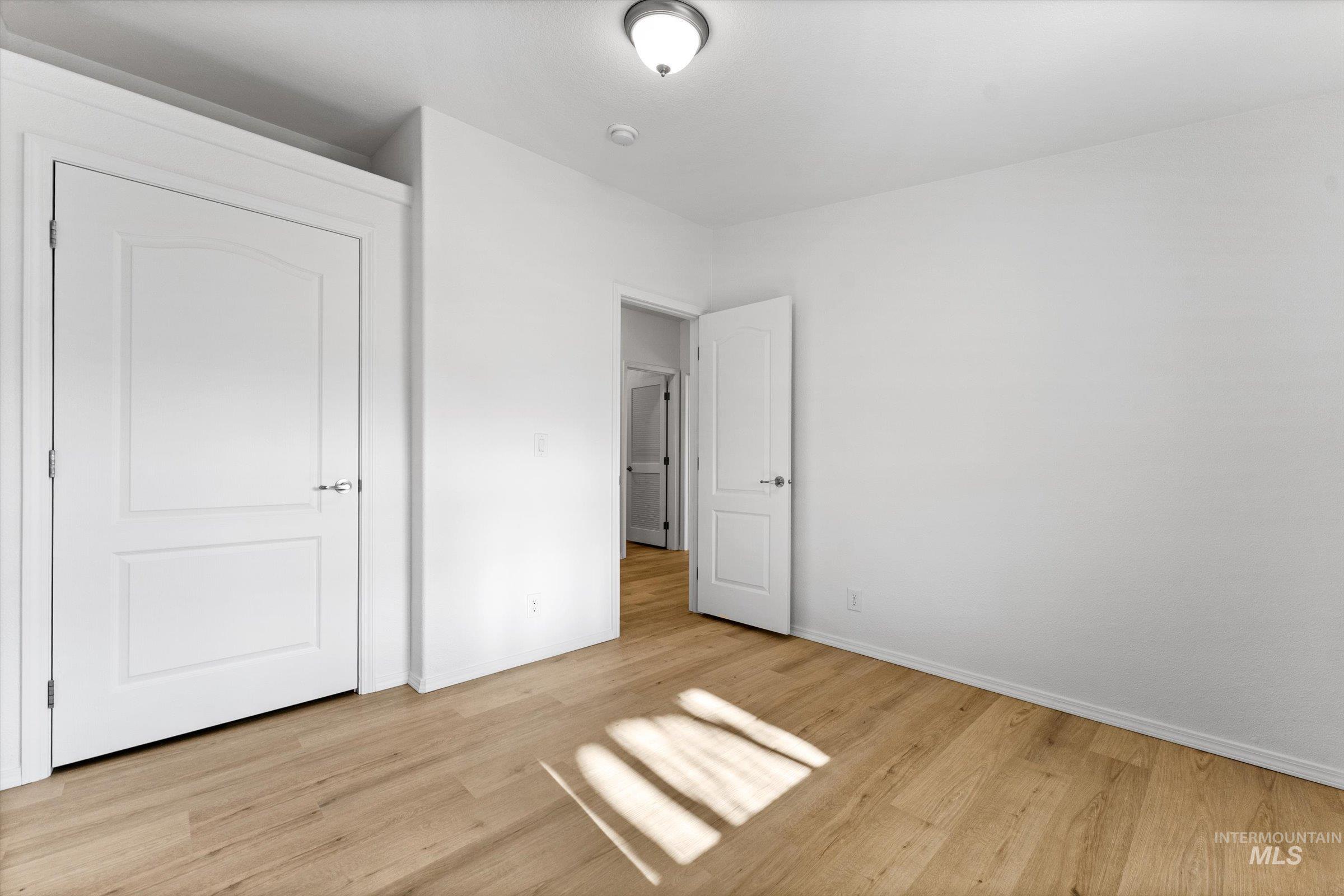 421 South Curtis Road, Unit 122 122 Boise, ID 83705 - Photo 13 of 24 Unfurnished bedroom with light wood-type flooring and baseboards