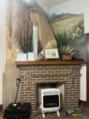 a stove top oven sitting next to a window