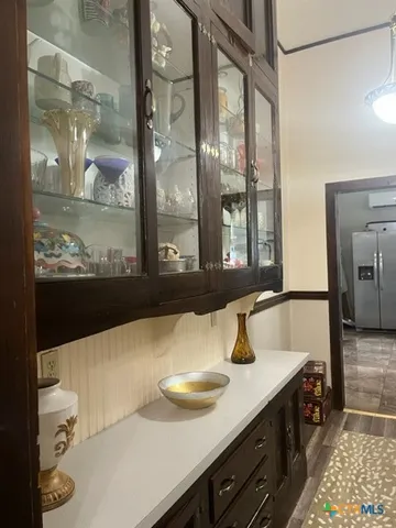 a bathroom with a sink and a large mirror