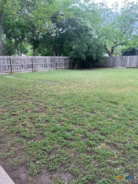 508 East Courthouse Street Cuero, TX 77954 - Photo 10 of 10 a view of a field with a trees in the background