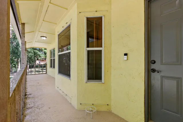 a view of a porch with seating space