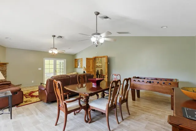 a dining room with furniture and window