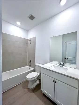 a view of a backyard with sitting area and umbrella