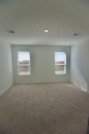 a view of a swimming pool with a yard