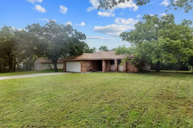 a backyard of a house with lots of green space
