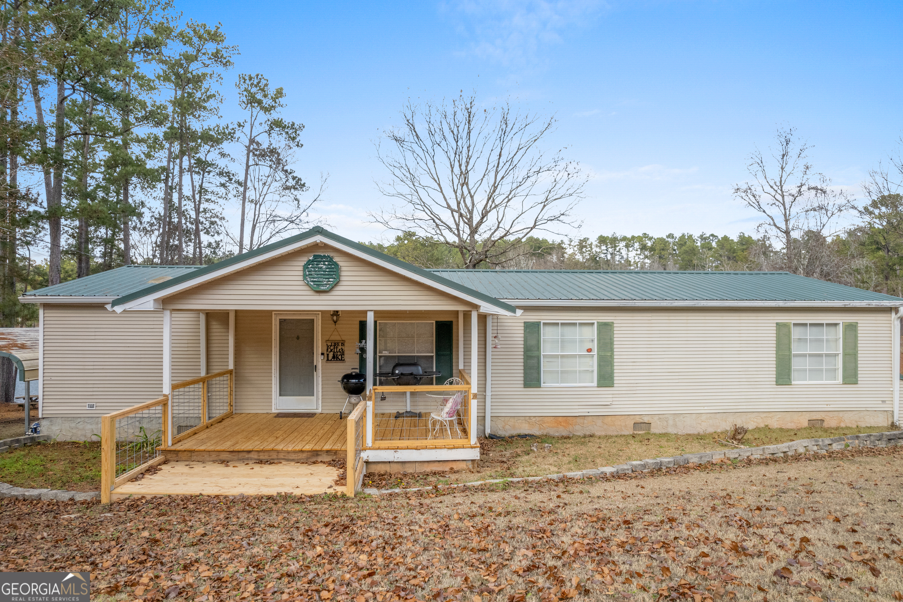 184 Brandywine Run Sparta, GA 31087 - Photo 19 of 72 a view of a house with a yard chairs and wooden fence