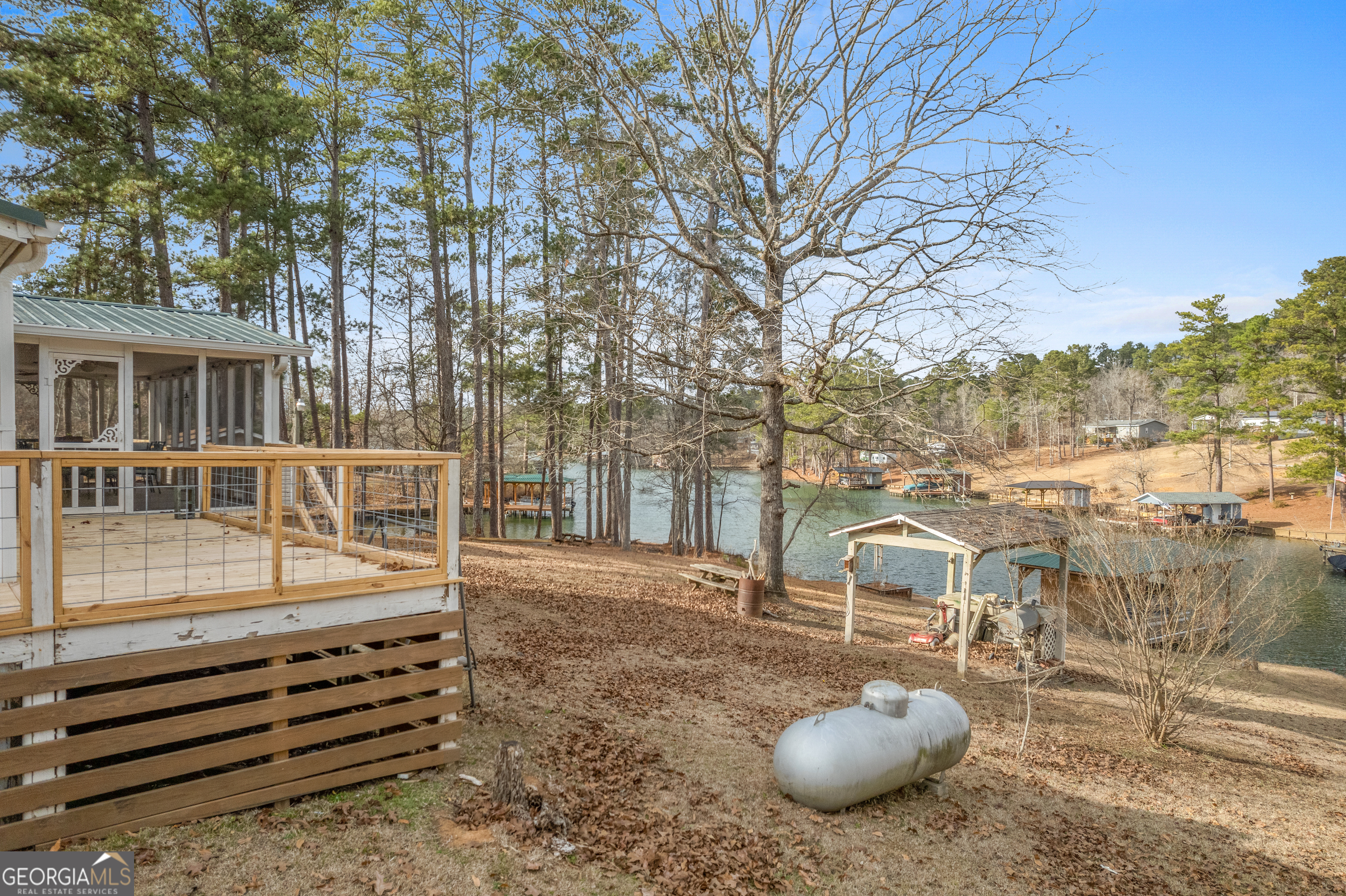 184 Brandywine Run Sparta, GA 31087 - Photo 27 of 72 a view of a chair and tables on the deck