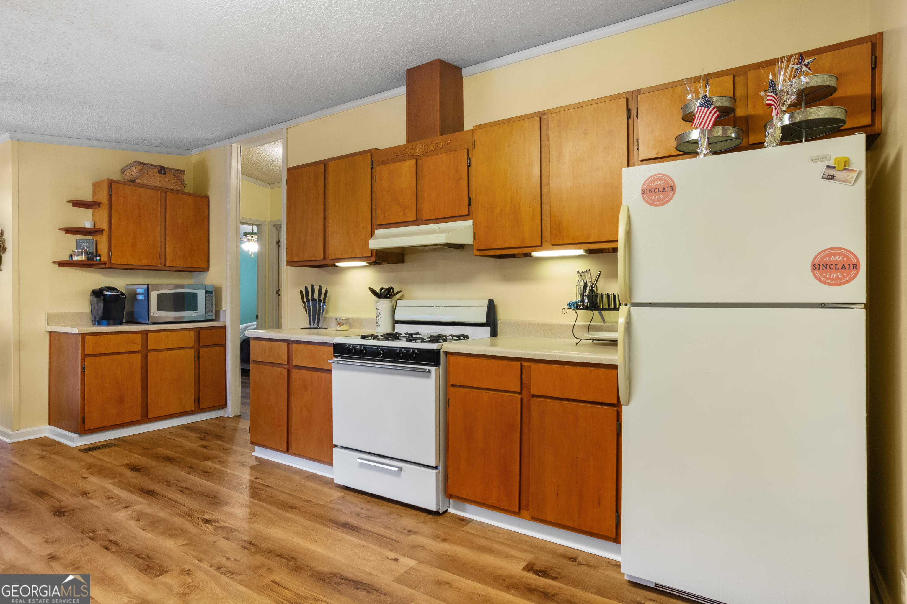 184 Brandywine Run Sparta, GA 31087 - Photo 46 of 72 a kitchen with stainless steel appliances granite countertop a refrigerator sink and cabinets