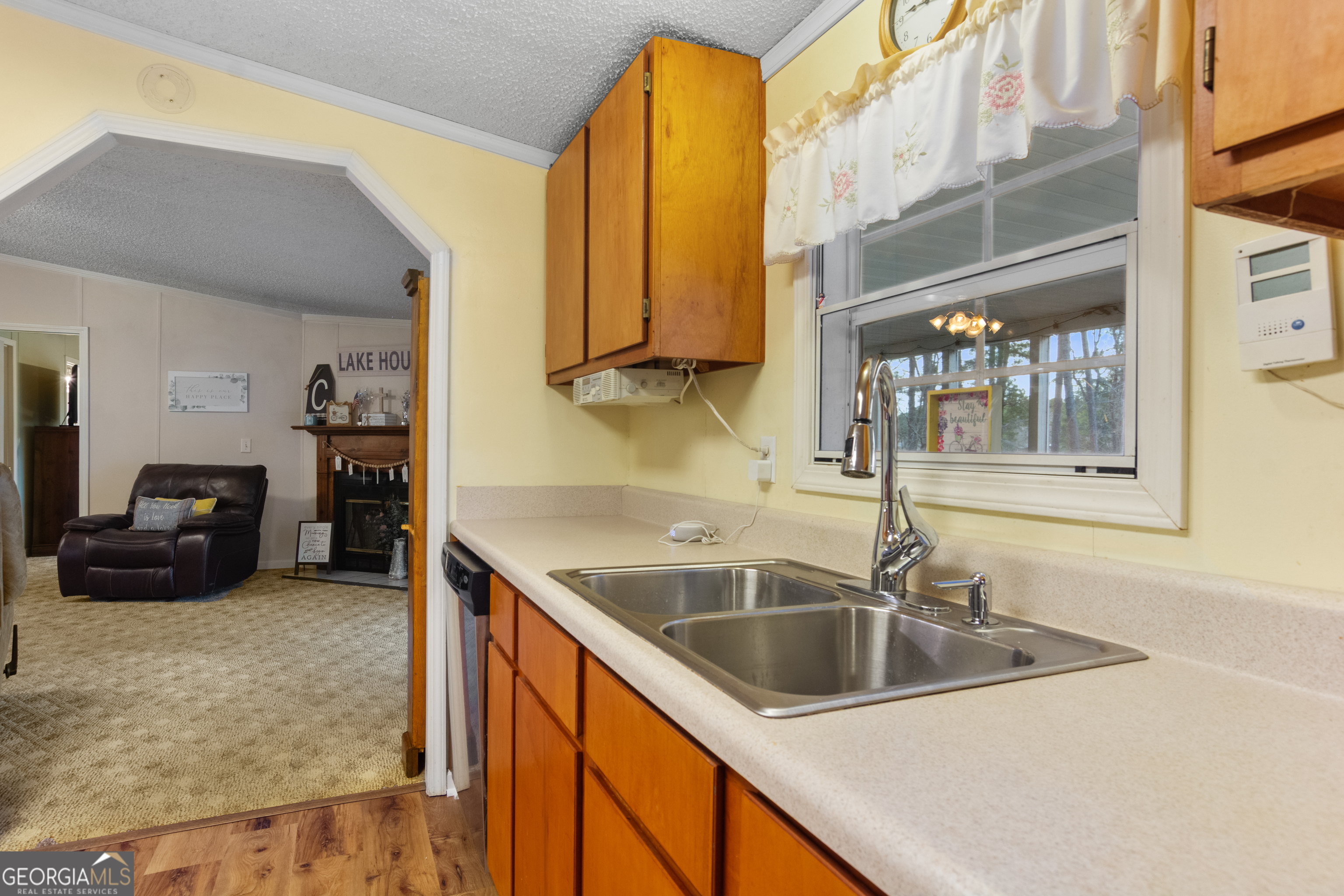 184 Brandywine Run Sparta, GA 31087 - Photo 47 of 72 a kitchen with a sink and a refrigerator