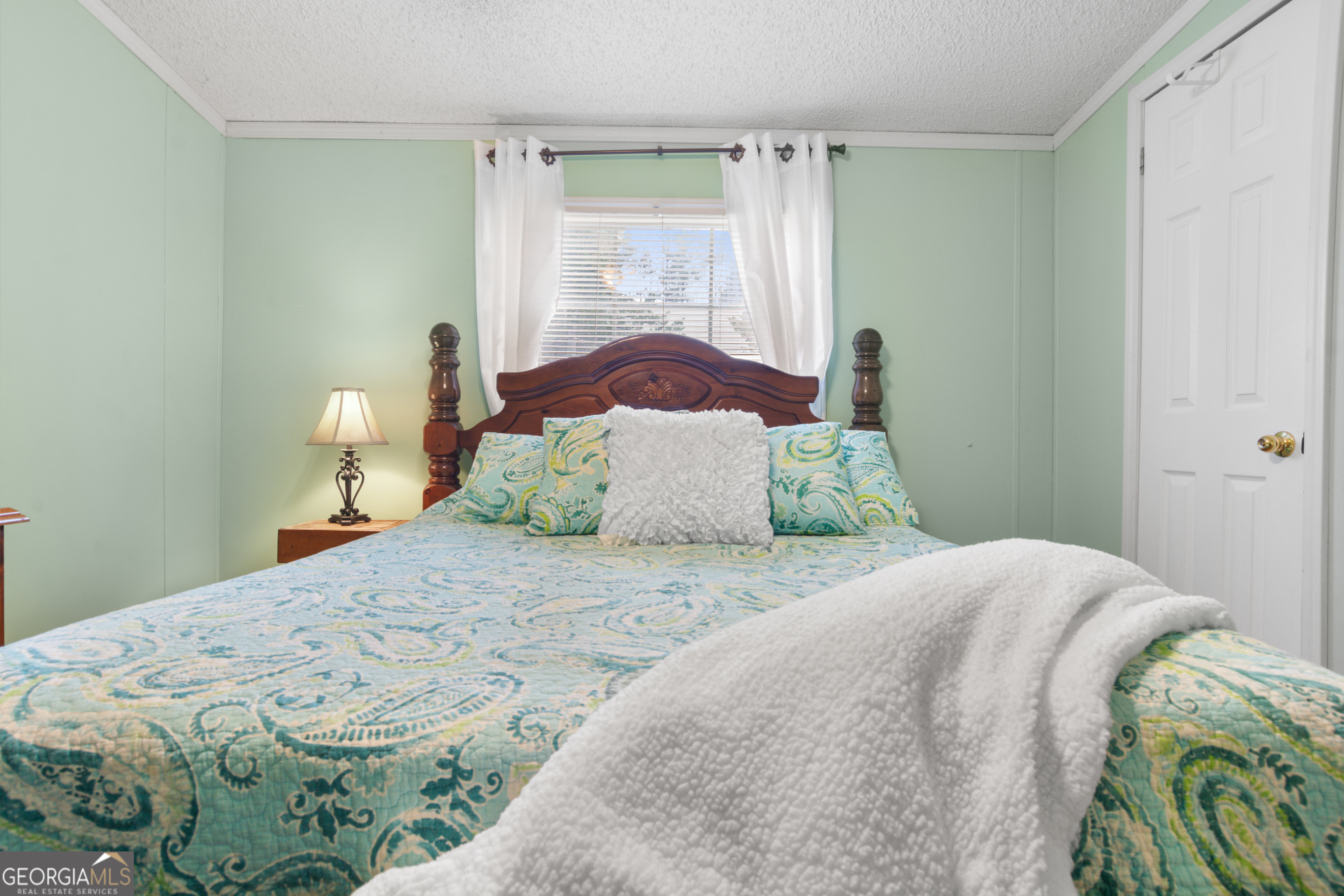 184 Brandywine Run Sparta, GA 31087 - Photo 54 of 72 a bedroom with a bed and window