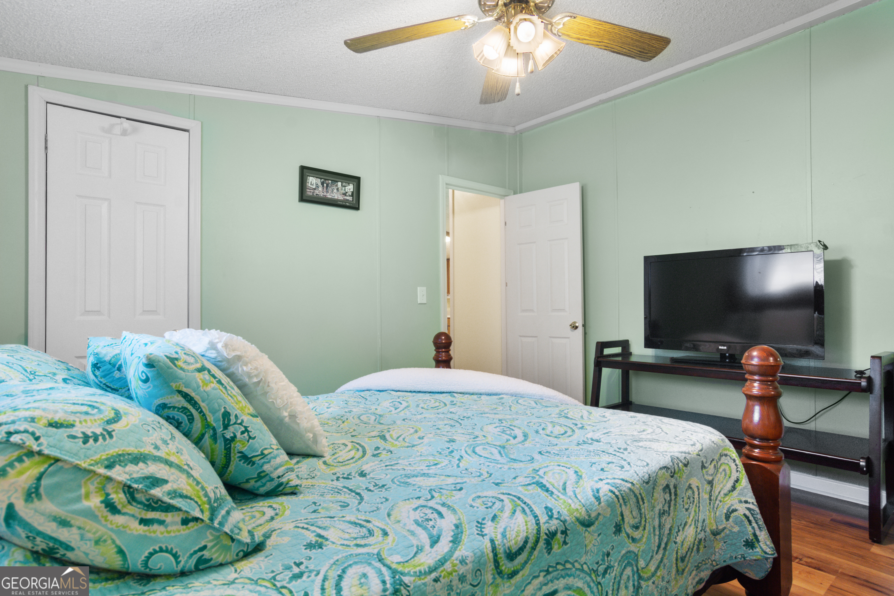 184 Brandywine Run Sparta, GA 31087 - Photo 55 of 72 a bedroom with a bed and a flat screen tv