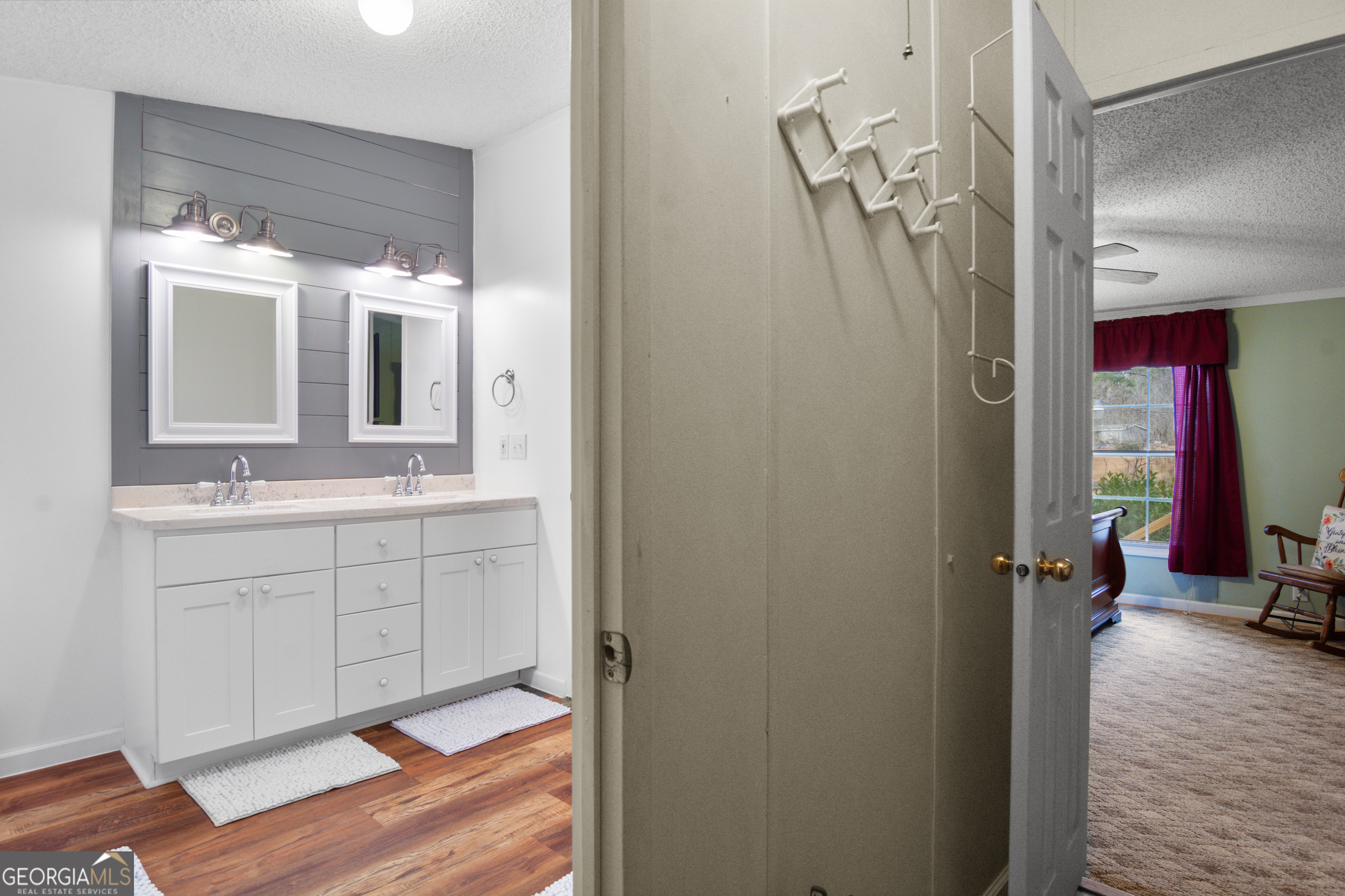 184 Brandywine Run Sparta, GA 31087 - Photo 68 of 72 a bathroom with a sink a mirror and a shower
