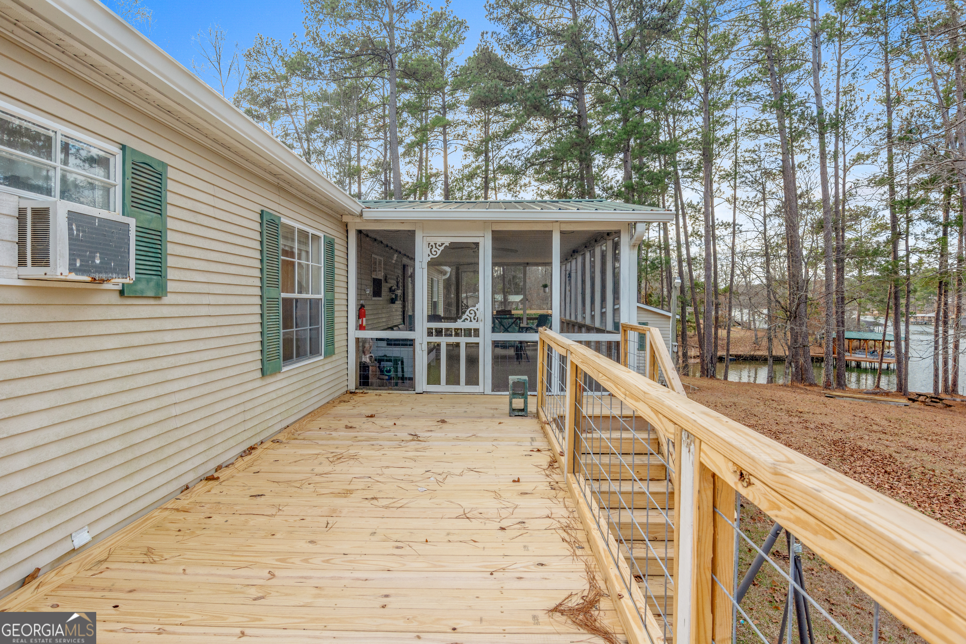 184 Brandywine Run Sparta, GA 31087 - Photo 72 of 72 a view of a house with wooden deck and backyard
