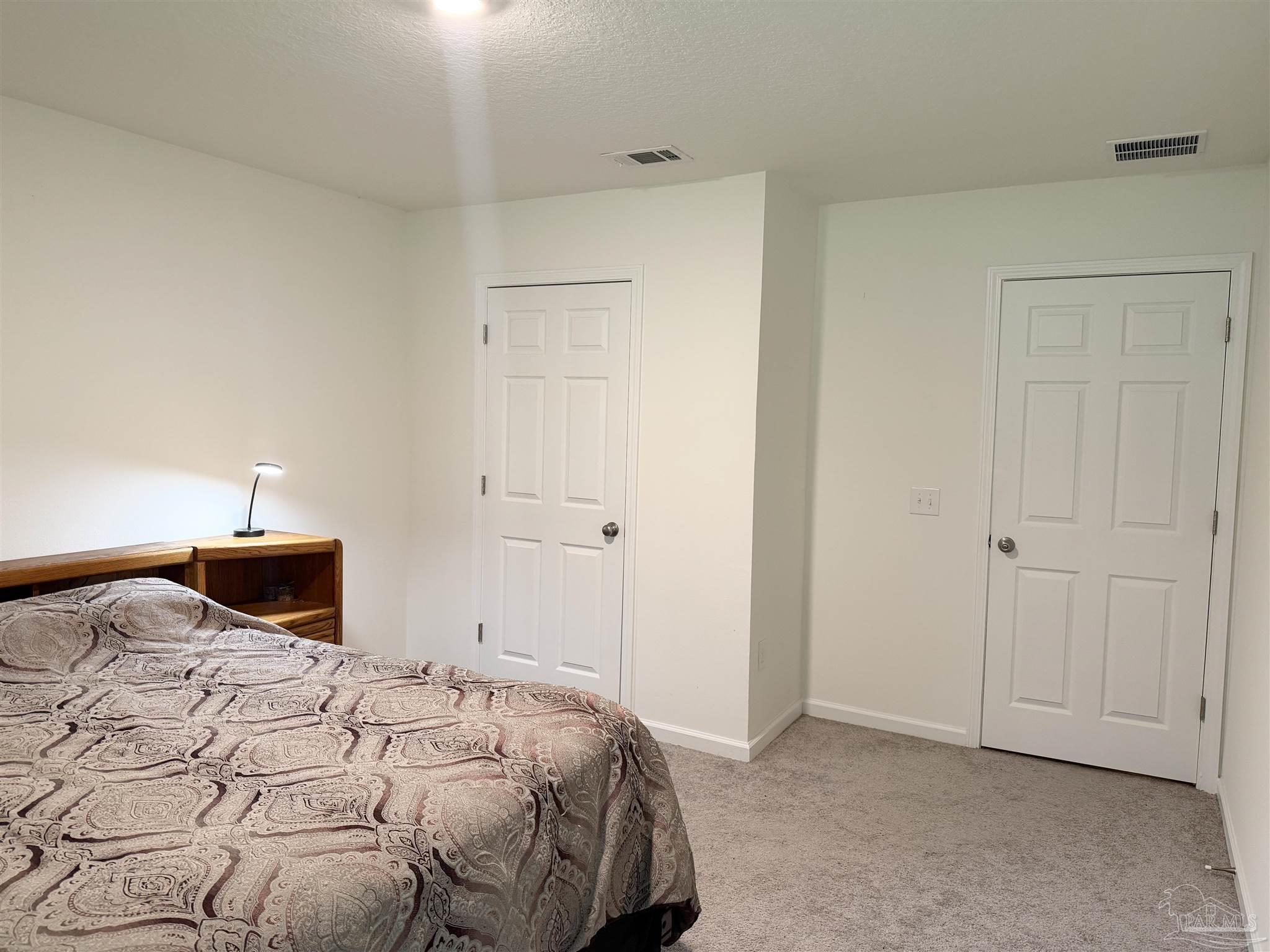 1625 Addies Way Pensacola, FL 32534 - Photo 42 of 50 a bedroom with a bed and a closet