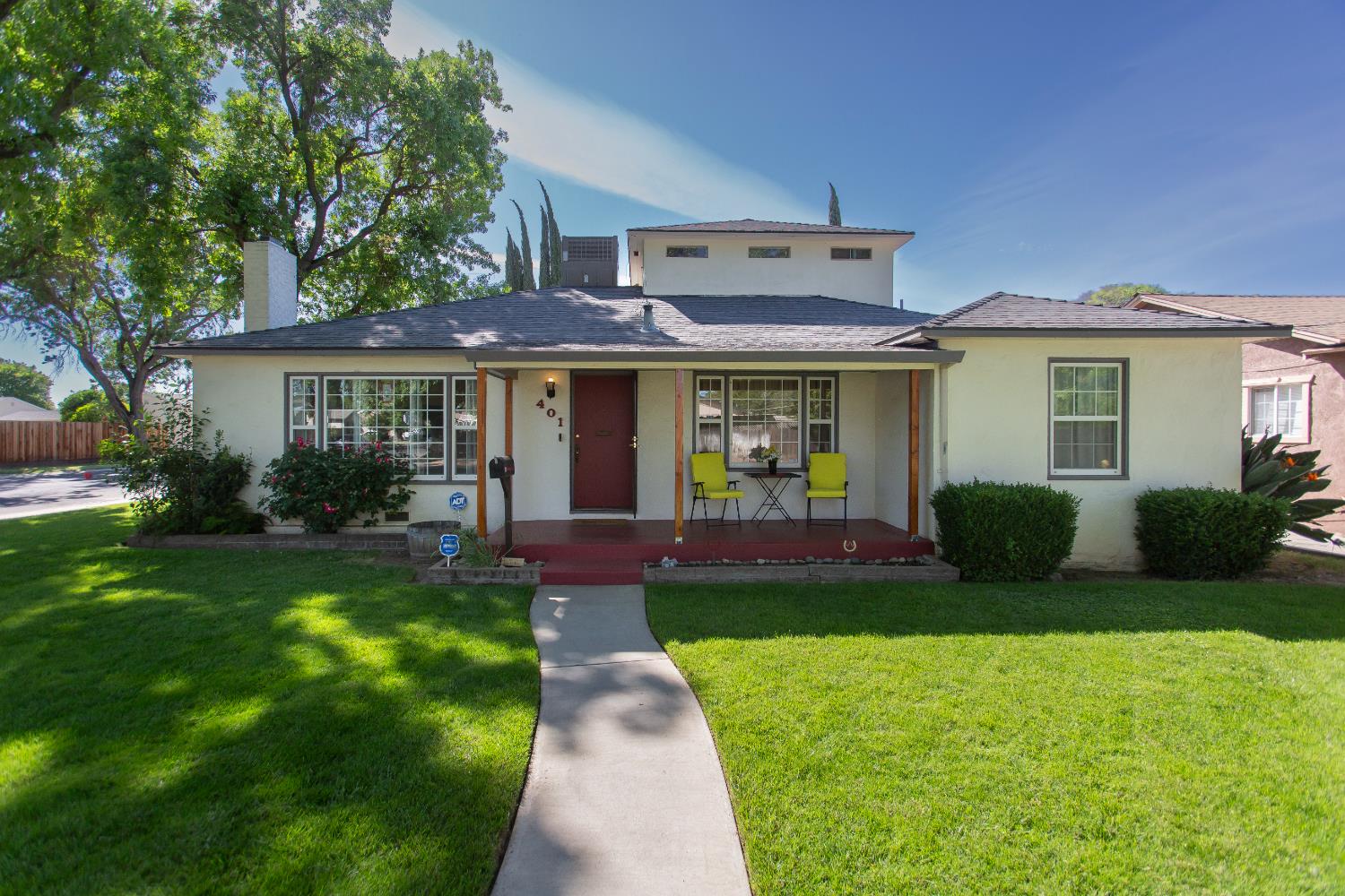 401 Fortuna Avenue Modesto, CA 95354 - Photo 2 of 43 a front view of a house with a yard and green space