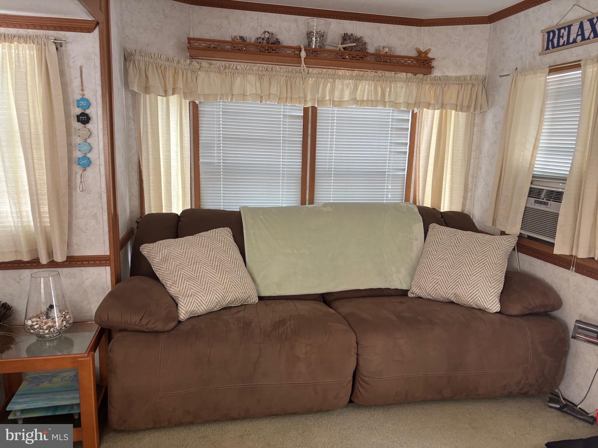 60 Corsons Tavern Road, Unit 248 Ocean View, NJ 08230 - Photo 11 of 18 a living room with furniture and a window