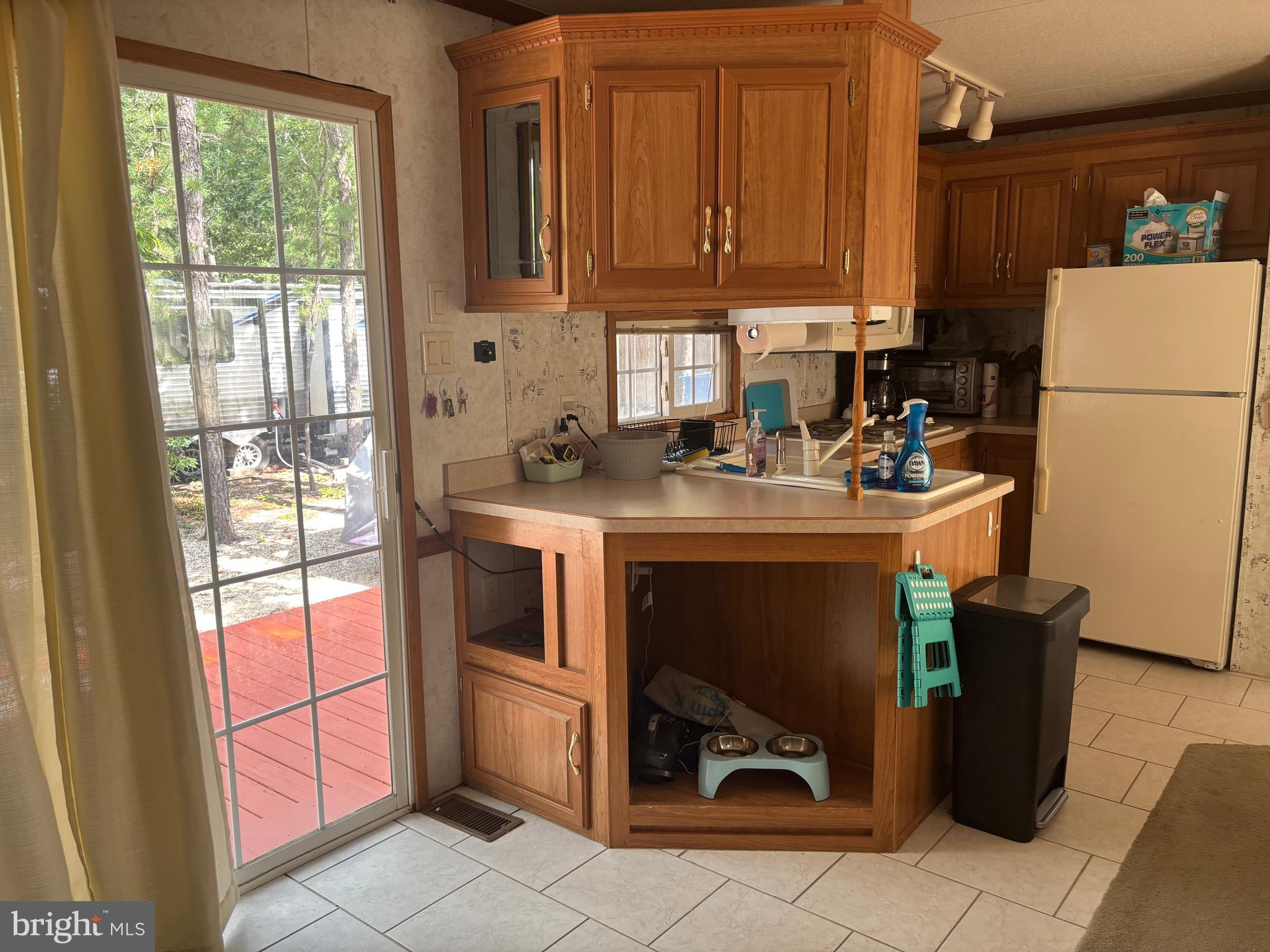 60 Corsons Tavern Road, Unit 248 Ocean View, NJ 08230 - Photo 15 of 18 a utility room with fridge dryer and washer