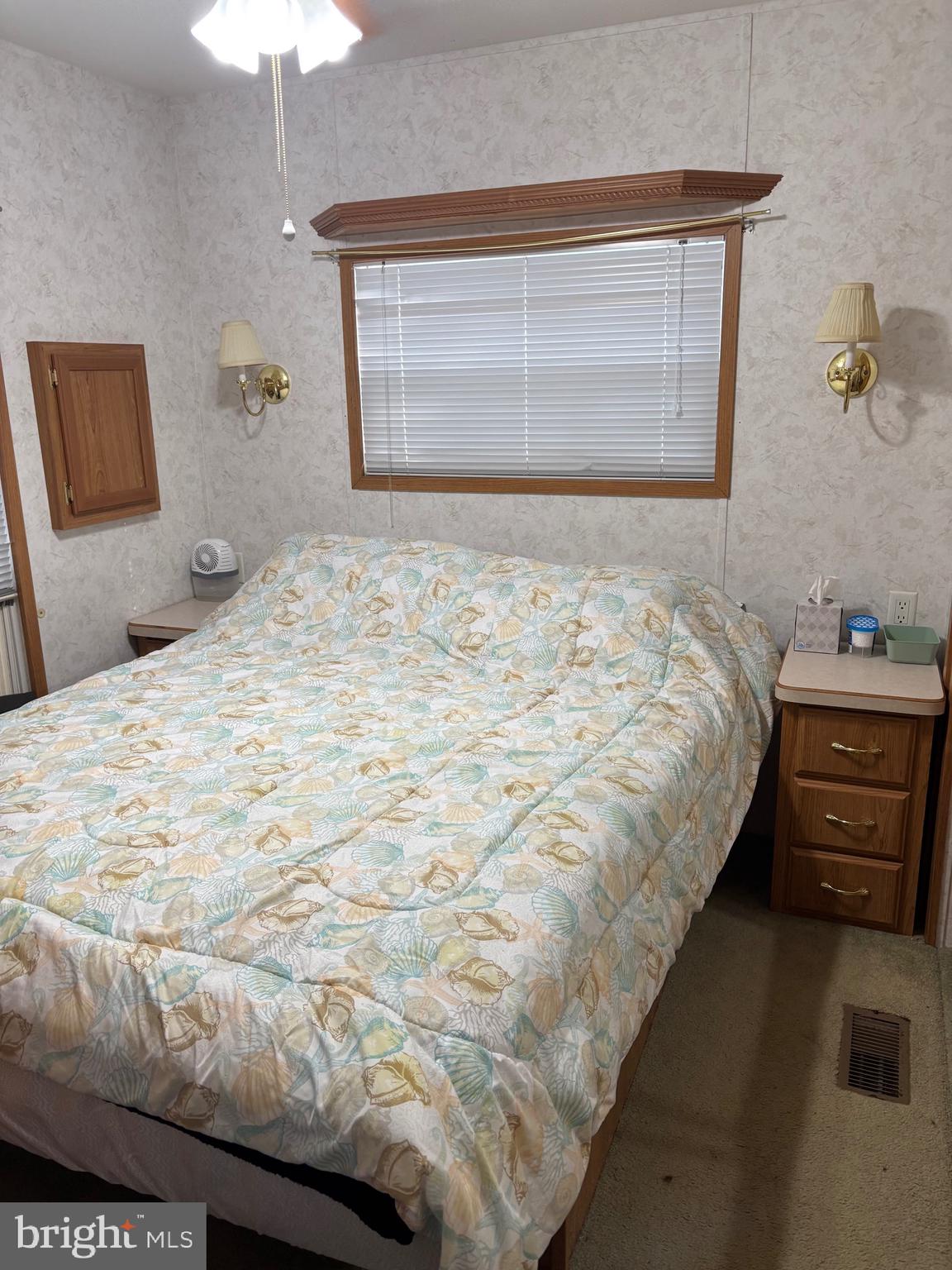 60 Corsons Tavern Road, Unit 248 Ocean View, NJ 08230 - Photo 17 of 18 a bedroom with a bed and a window