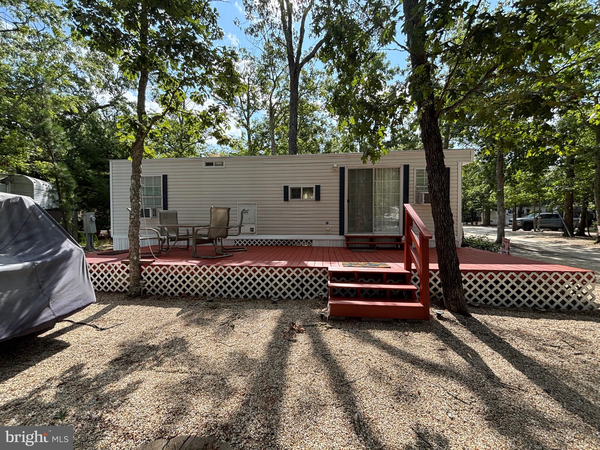 60 Corsons Tavern Road, Unit 248 Ocean View, NJ 08230 - Photo 6 of 18 a front view of a house with a garden