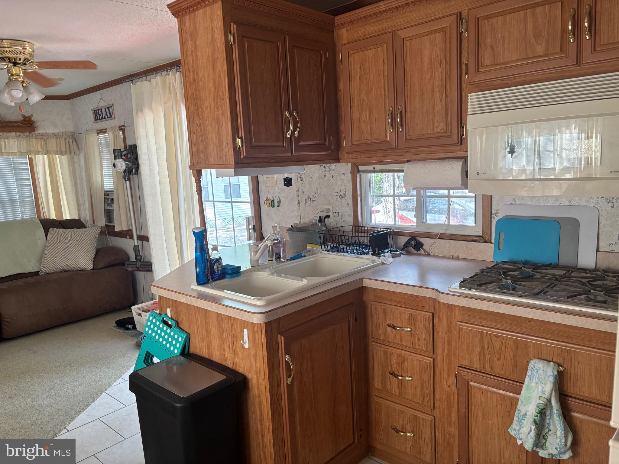 60 Corsons Tavern Road, Unit 248 Ocean View, NJ 08230 - Photo 8 of 18 a kitchen with a stove and a refrigerator