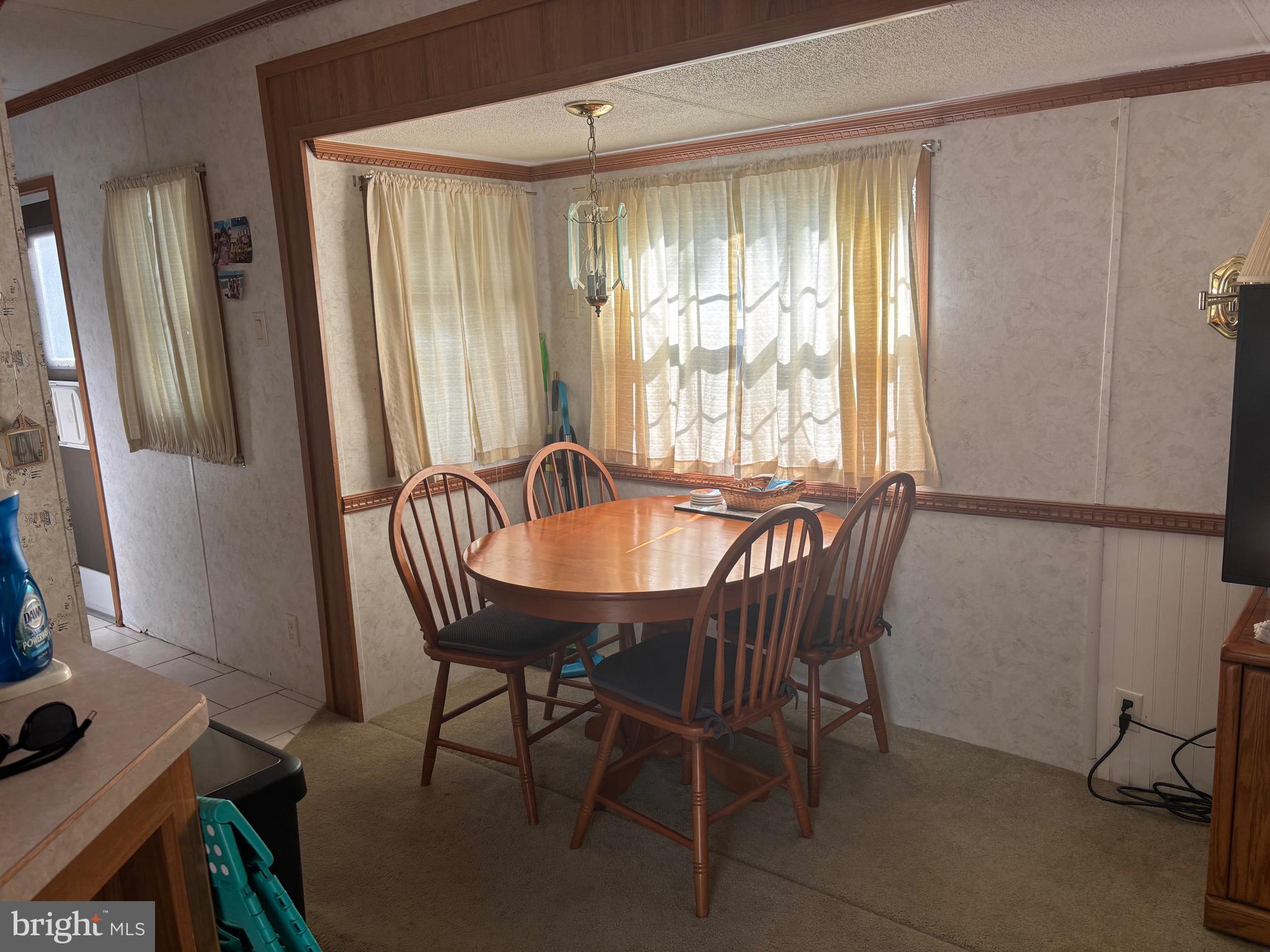 60 Corsons Tavern Road, Unit 248 Ocean View, NJ 08230 - Photo 10 of 18 a view of a dining room with furniture and window