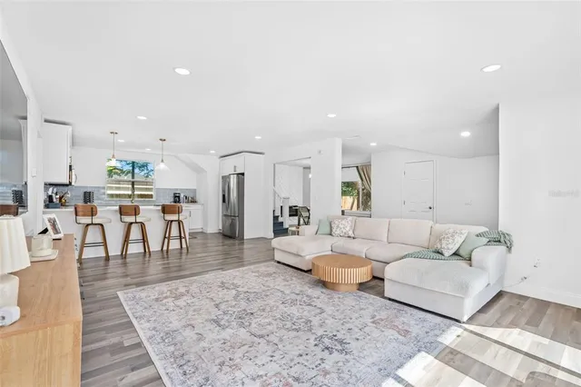 a living room with lots of furniture and a table