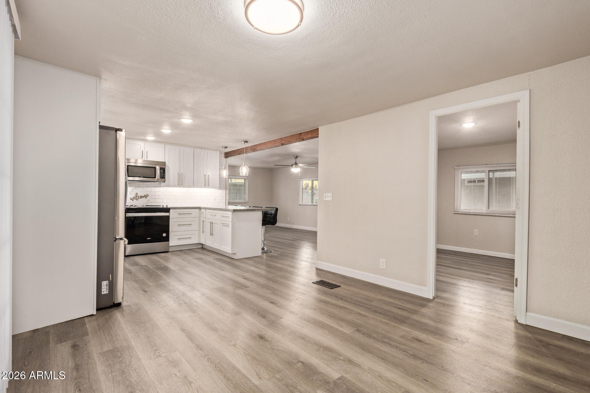 400 West Baseline Road, Unit 312 Tempe, AZ 85283 - Photo 16 of 32 a view of a kitchen with a sink and a refrigerator