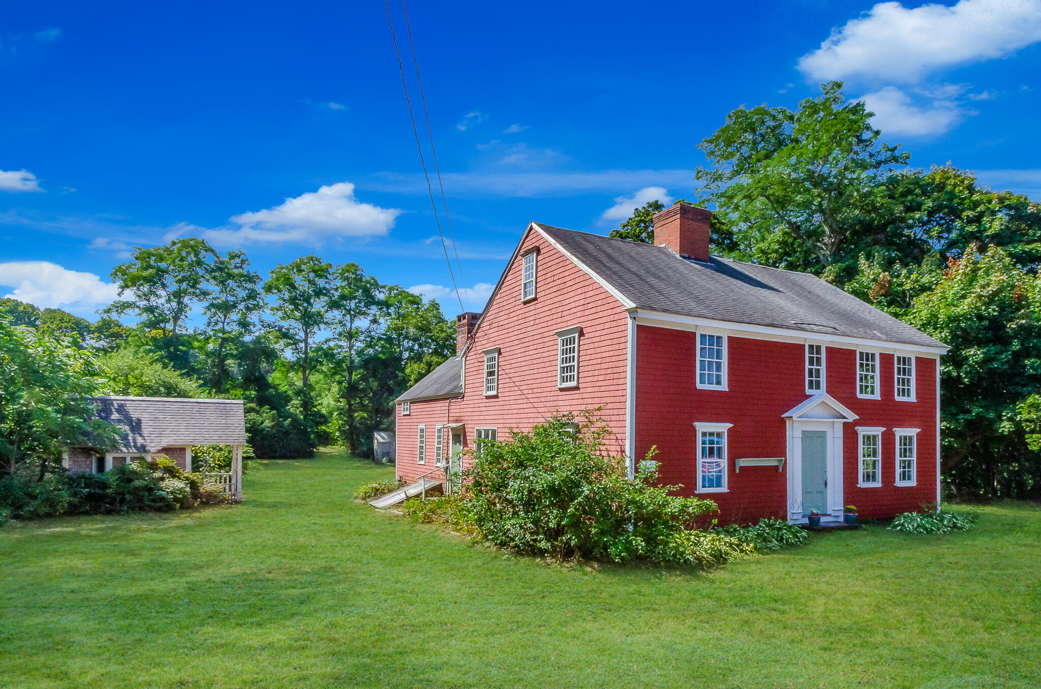 4701 Falmouth Road Cotuit, MA 02635 - Photo 1 of 39 a view of a house with a yard