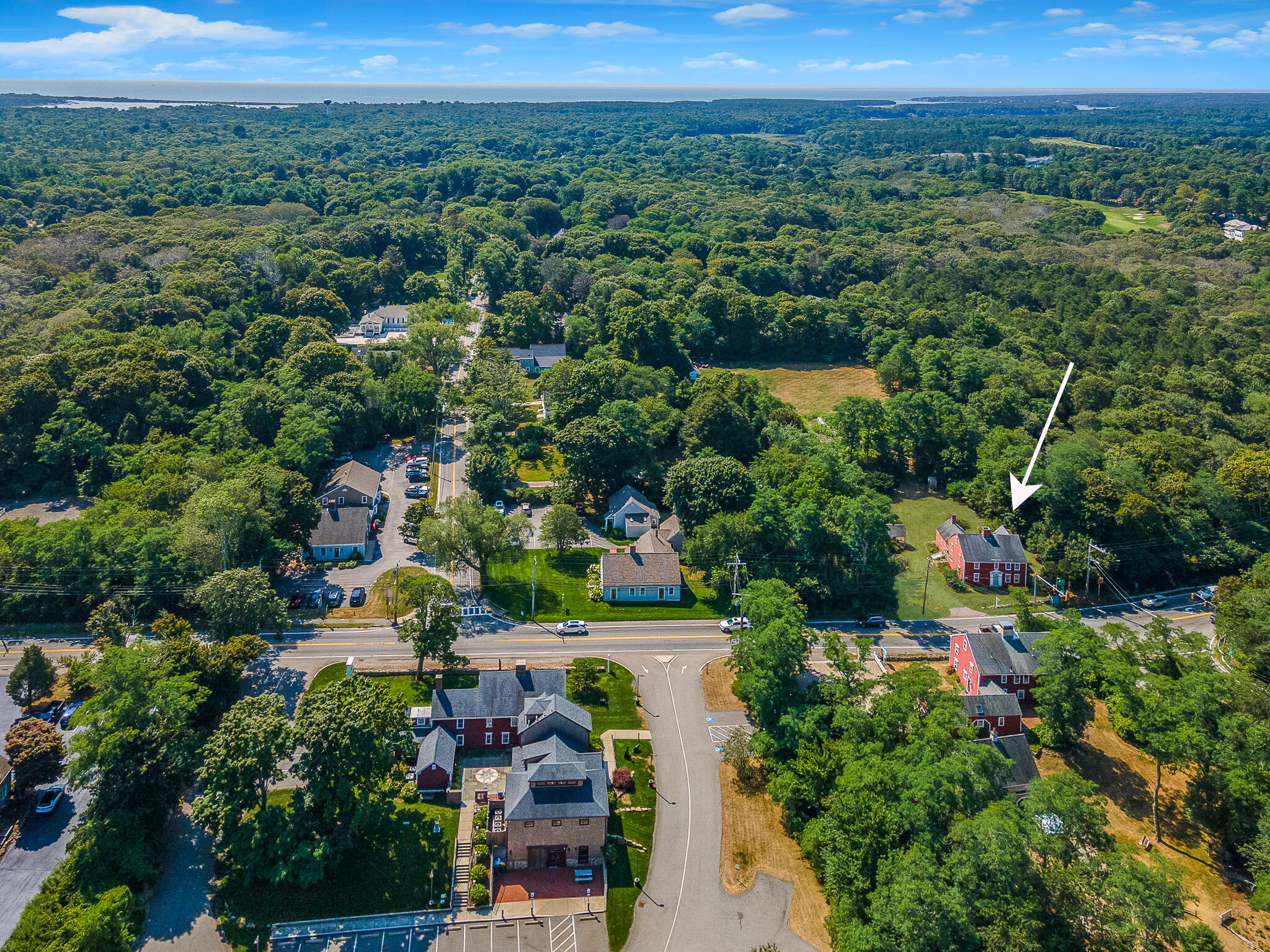 4701 Falmouth Road Cotuit, MA 02635 - Photo 12 of 39 an aerial view of a houses with a yard and lake view