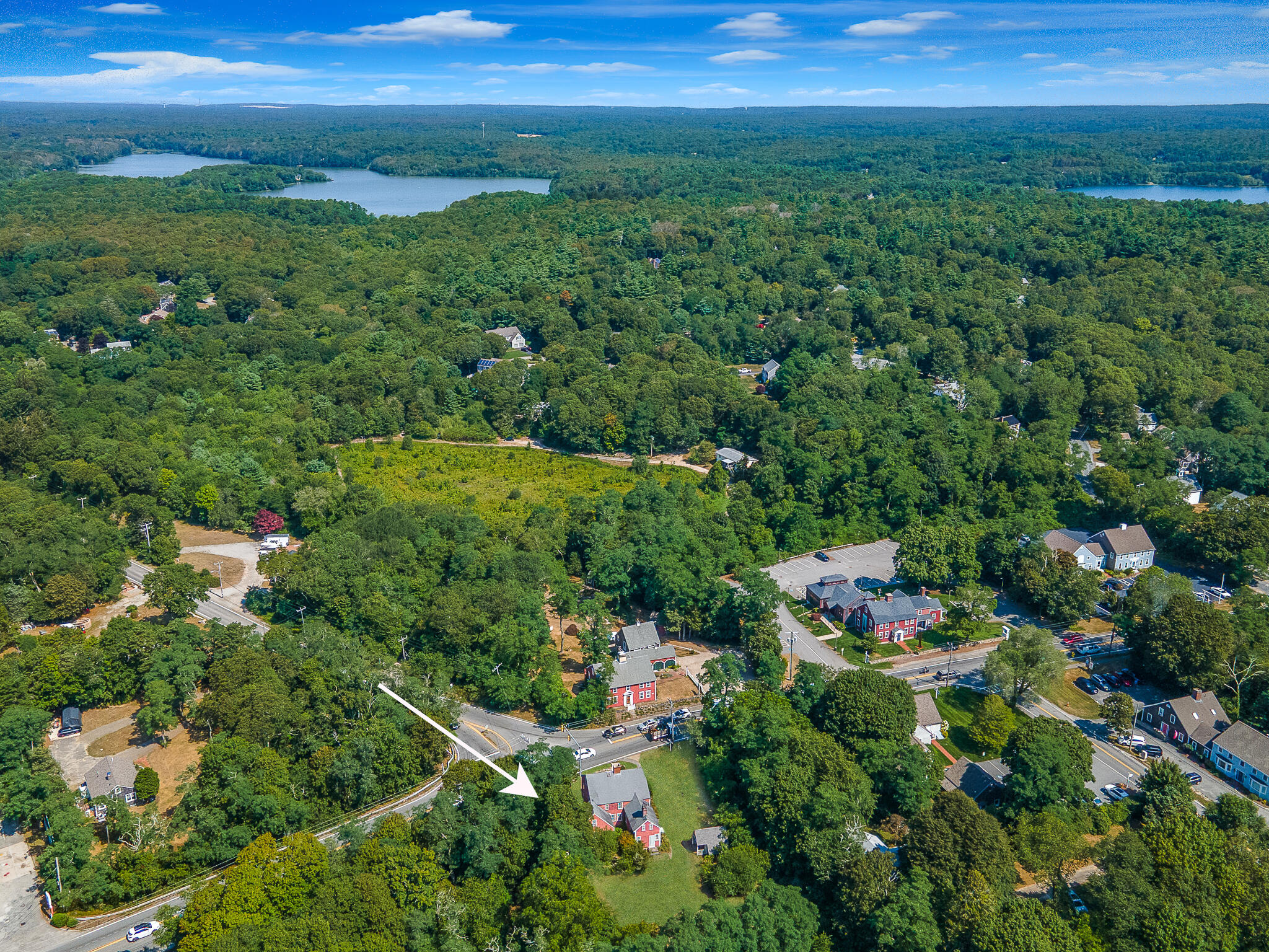 4701 Falmouth Road Cotuit, MA 02635 - Photo 14 of 39 a view of a garden with a houses
