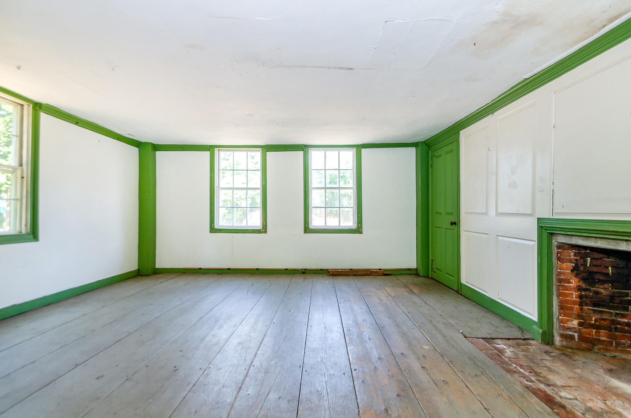 4701 Falmouth Road Cotuit, MA 02635 - Photo 15 of 39 an empty room with wooden floor and windows
