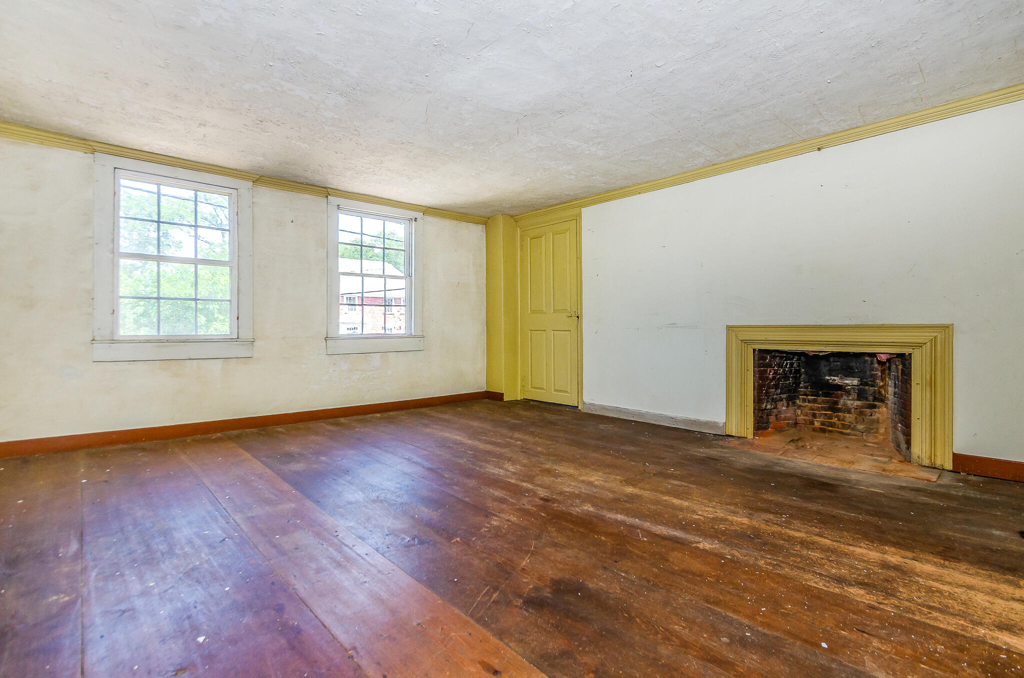 4701 Falmouth Road Cotuit, MA 02635 - Photo 19 of 39 an empty room with wooden floor and windows