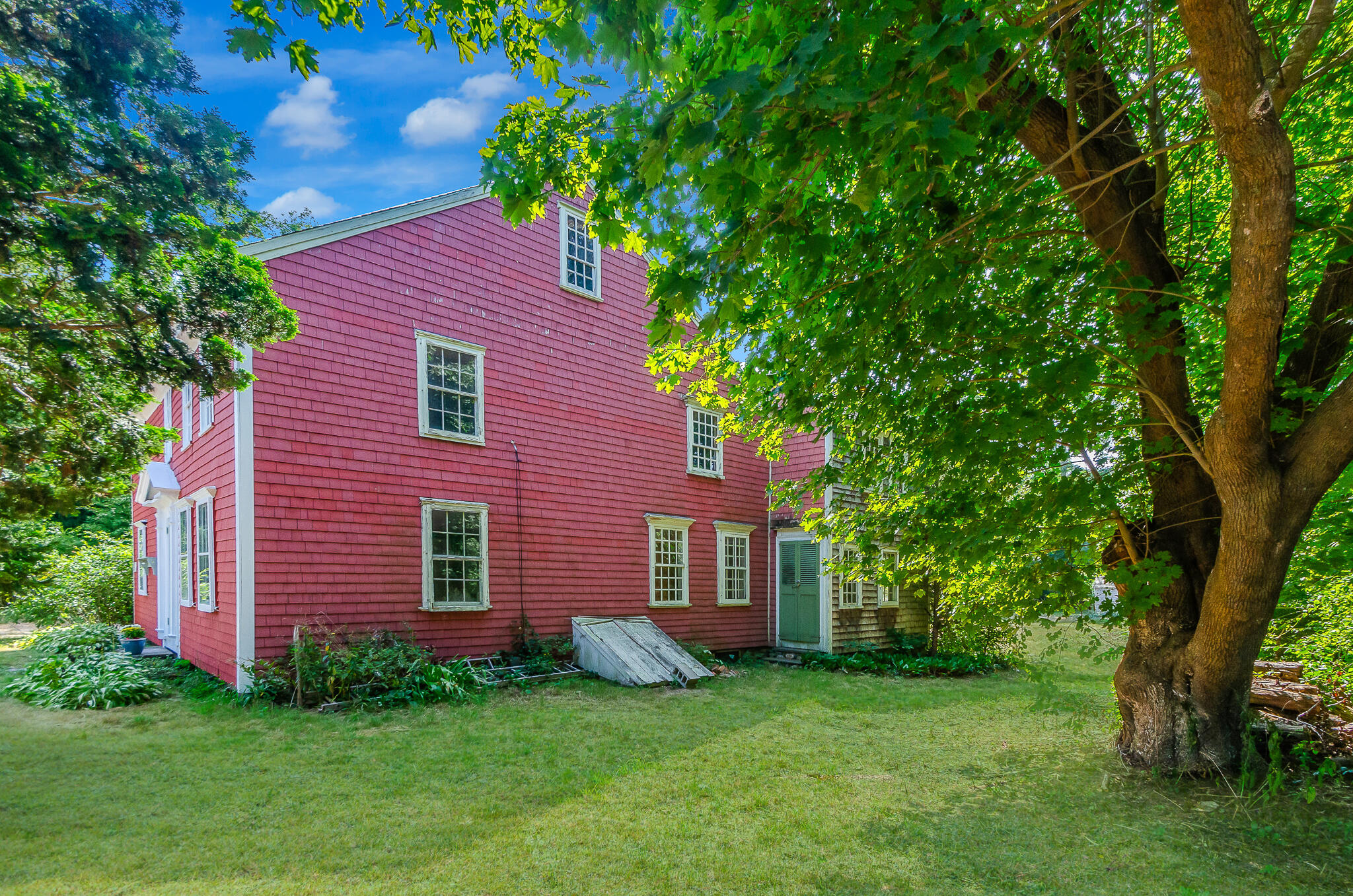4701 Falmouth Road Cotuit, MA 02635 - Photo 2 of 39 a view of a brick house with a yard