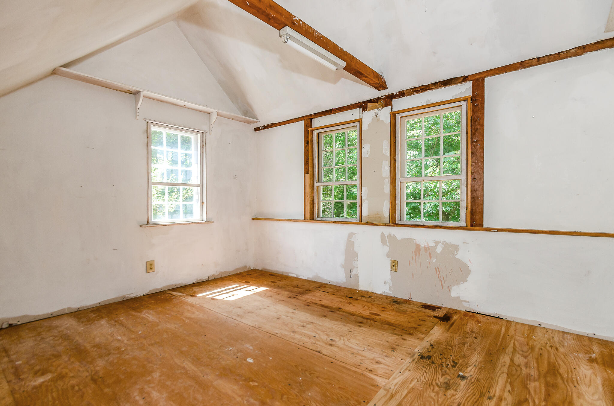 4701 Falmouth Road Cotuit, MA 02635 - Photo 22 of 39 a view of an empty room with a window