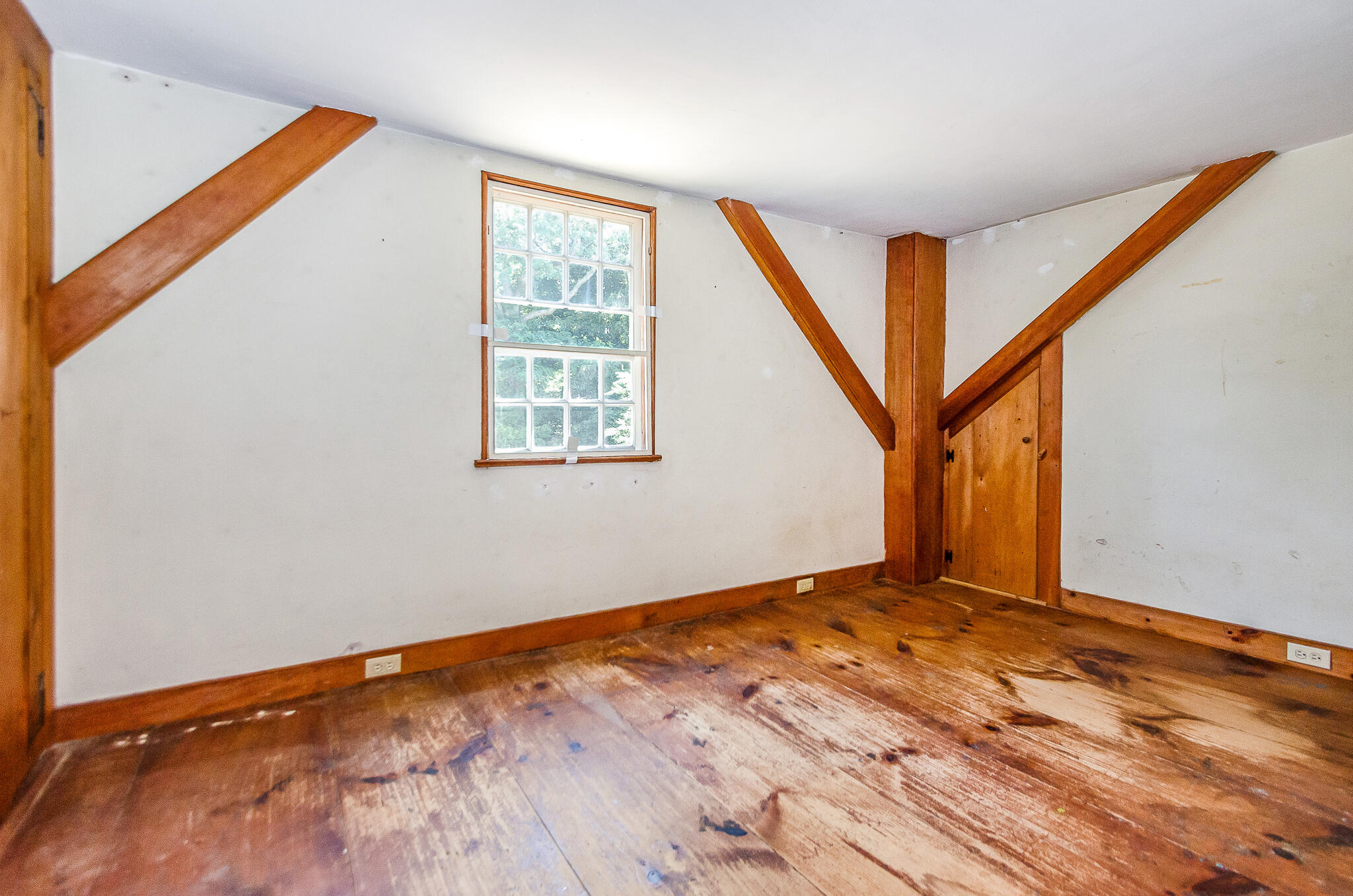4701 Falmouth Road Cotuit, MA 02635 - Photo 24 of 39 a view of an empty room with wooden floor and a window