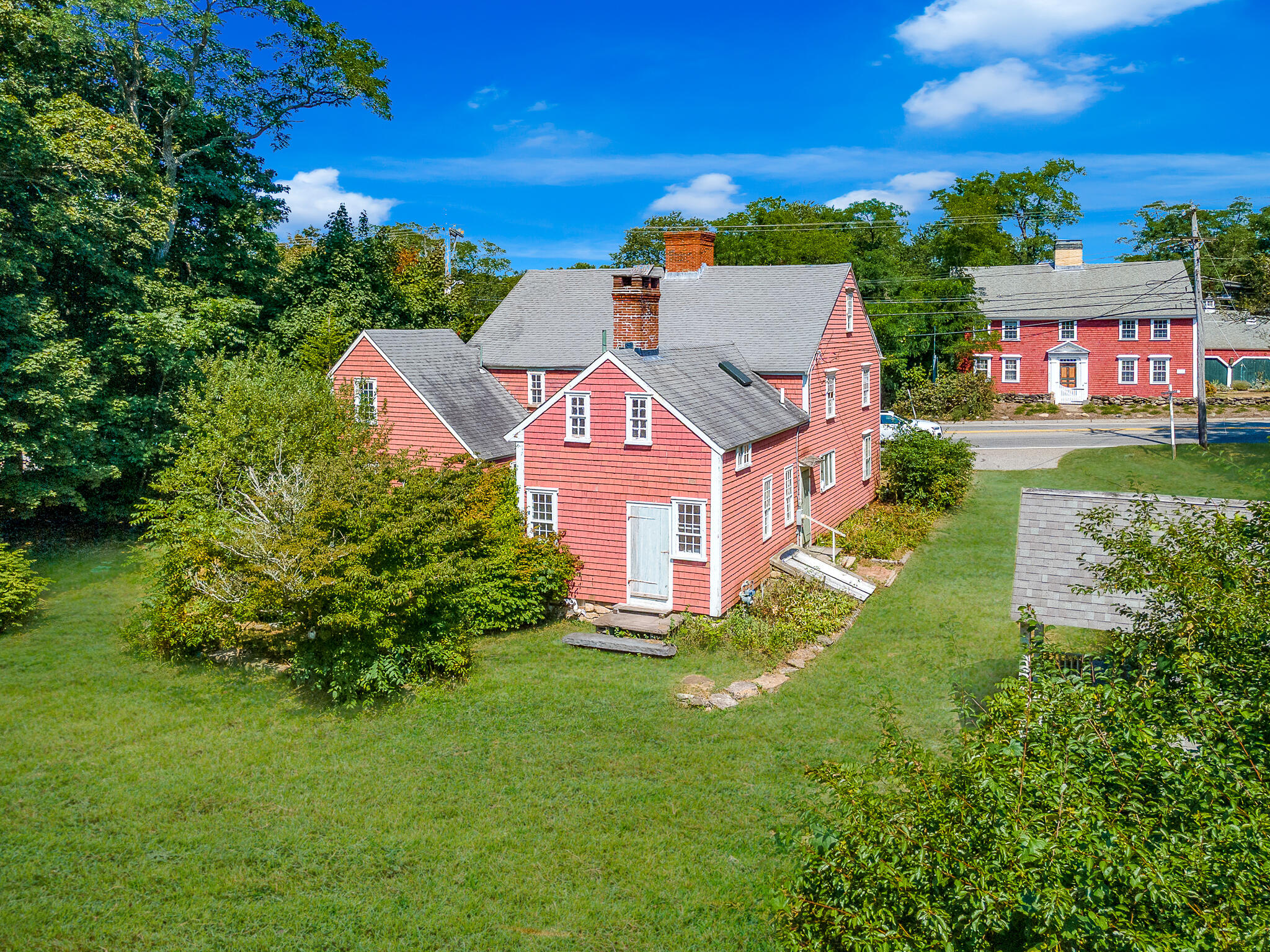 4701 Falmouth Road Cotuit, MA 02635 - Photo 3 of 39 a aerial view of a house with garden space and street view