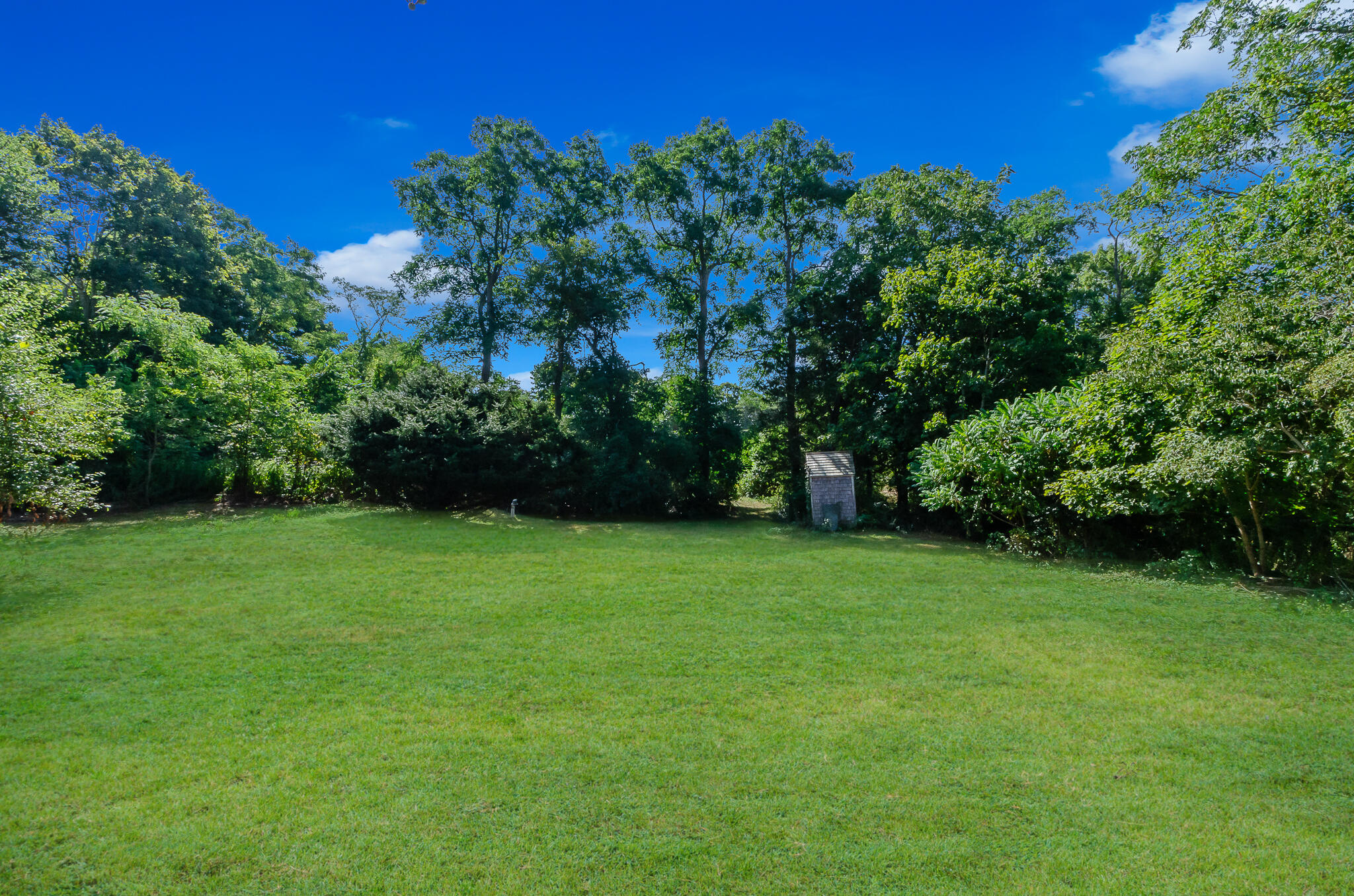 4701 Falmouth Road Cotuit, MA 02635 - Photo 7 of 39 a view of a grassy field
