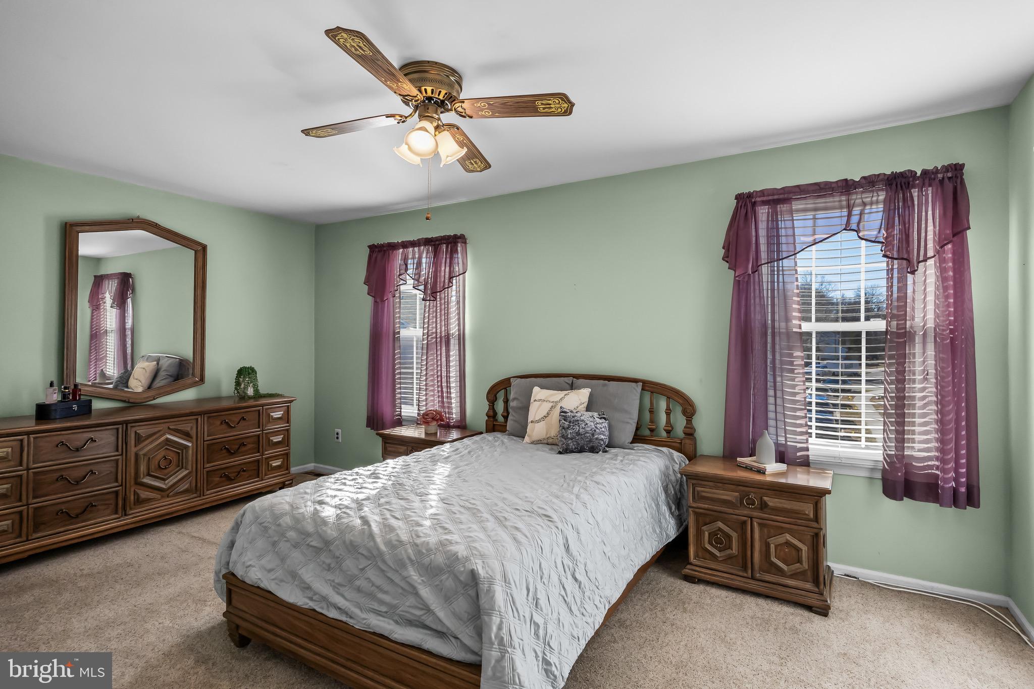 40 Blue Jay Drive Clementon, NJ 08021 - Photo 13 of 27 a bedroom with a bed and dresser with mirror