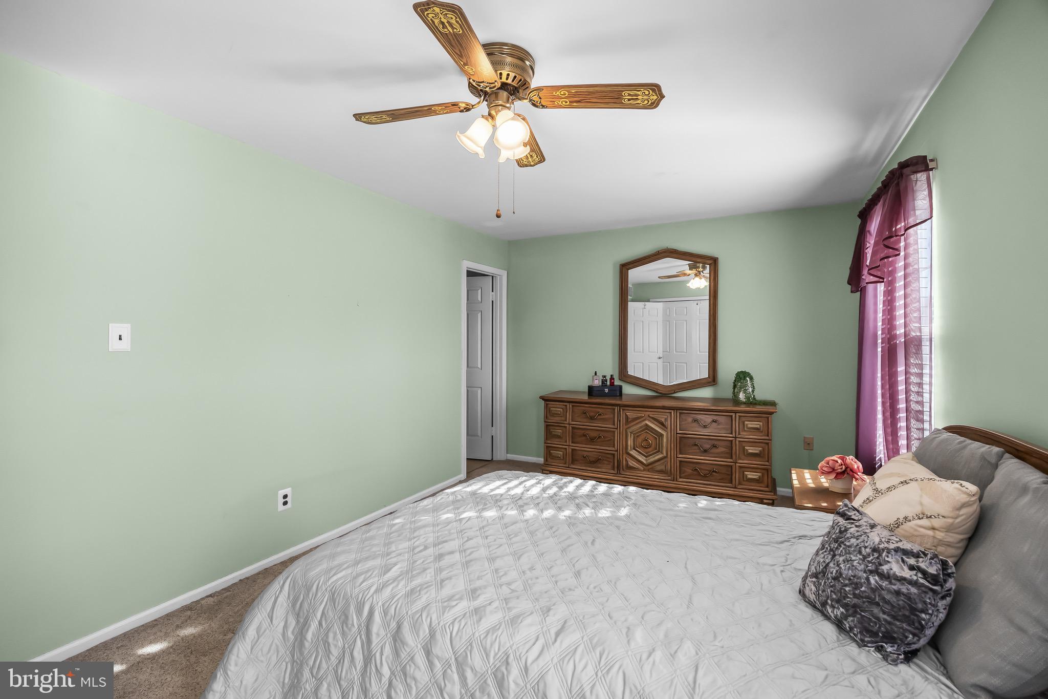 40 Blue Jay Drive Clementon, NJ 08021 - Photo 14 of 27 a bedroom with a bed and dresser with mirror